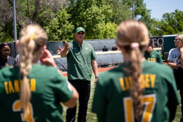 Head coach Glenn Moore debriefs with his team after the Bears' ..... against Utah at Getterman Stadium on Sunday.