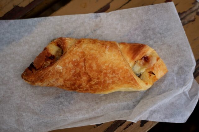 The onion and gorgonzola croissant had a delicious buttery crust and a memorable sharp flavor. Sophia Monson | Social Media Editor