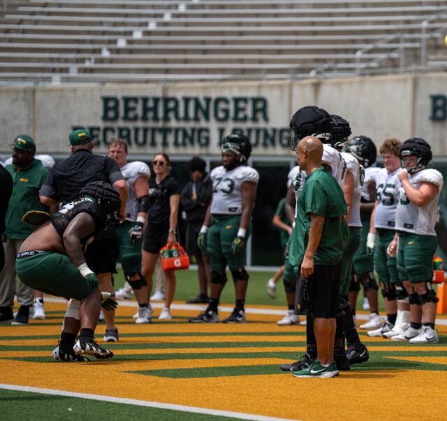 Coaches run drills with defensive linemen at football open practice Saturday afternoon at McLane Stadium. Alyssa Myers | Photographer