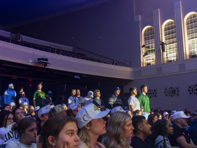 Students lined up to ask questions to "Border czar" Tom Homan and political commentator Benny Johnson during a Q&A session.