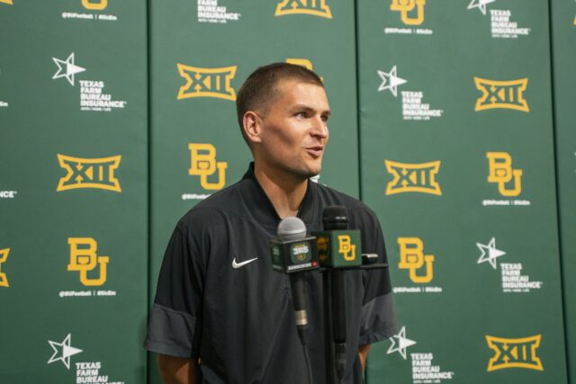 Defensive ends coach Carson Hall had good things to say about his group, which features a blend of veterans and high-impact transfers. Jake Schroeder | Photographer