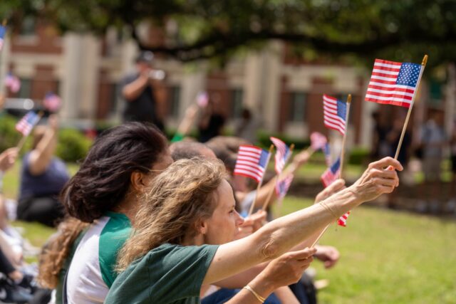 Attendees offer up three cheers for the Declaration of Independence at the SUB Bowl on Friday afternoon. Caleb Garcia | Photographer