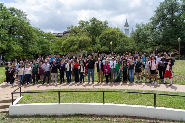 Faculty and attendees pose for a photo after the full reading of the Declaration of Independence at the SUB Bowl on Friday afternoon. Caleb Garcia | Photographer