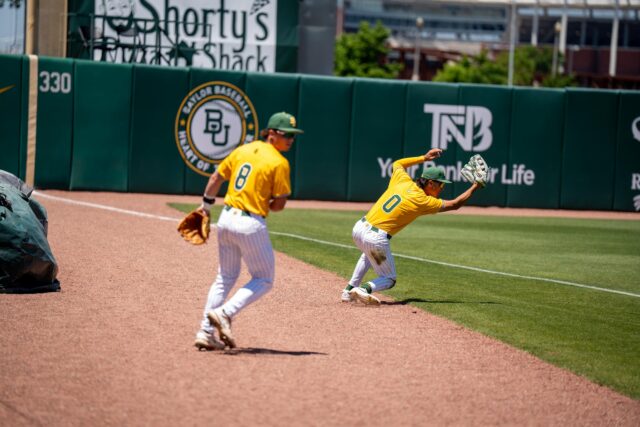 Freshman outfielder Dylan Perez and freshman third baseman Cole Lanclos scramble to catch a foul ball during the Bears' 8-3 loss against Texas Tech on Sunday. Sam Gassaway | Photo Editor