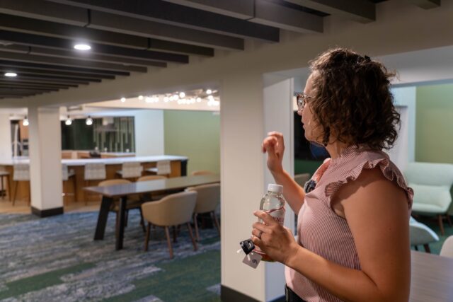 Nichloe Bekken leads a tour through the newly renovated dormitory. Caleb Garcia | Photo Editor