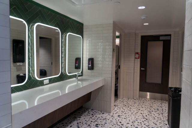 Renovated bathrooms bear new tile, privatized showers and lighted mirrors. Caleb Garcia | Photo Editor