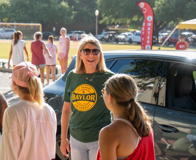 Dr. Linda Livingstone smiles at students outside of North Russel Hall during Move2BU on Thursday morning. Vanessa Adams | Photographer