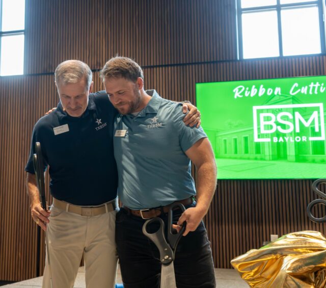 TXBSM State Director Dr. Mark Jones and BSM Director Will Bowden embrace after the ribbon cutting. Mesha Mittanasala | Photographer