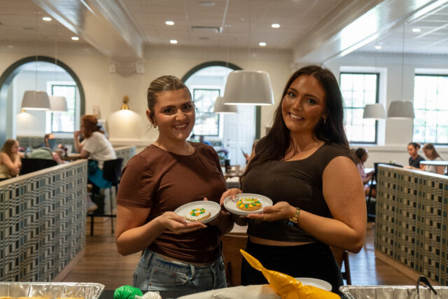 Brenham freshman Victoria Dippel and Atlanta freshman Brooklyn Thompson show off their decorated cookies during the grand opening of Memorial Dining Hall at 2 p.m. on Thursday. Vanessa Adams | Photographer