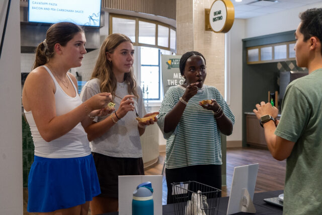 Students try free samples while listening to a presenter talk about food options during the grand opening of Memorial Dining Hall at 2 p.m. on Thursday. Vanessa Adams | Photographer