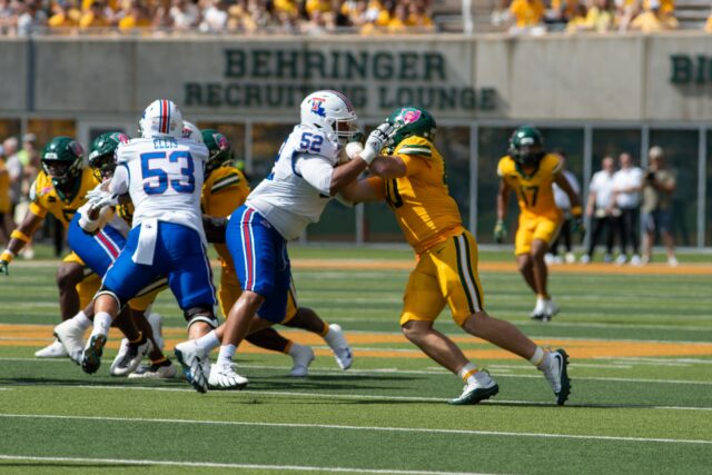 Fifth year senior defensive end Kyler Jordan pushes his opponent during the Louisiana Tech game in the McLane Stadium on Saturday at 3 p.m. Vanessa Adams | Photographer