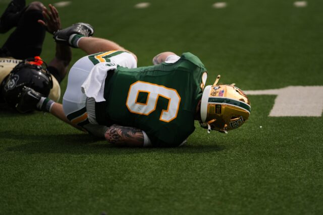 Fifth-year wide receiver Gavin Freeman takes a fall to protect the Baylor ball against Colorado at McLane Stadium. Mady Mijares | Photographer