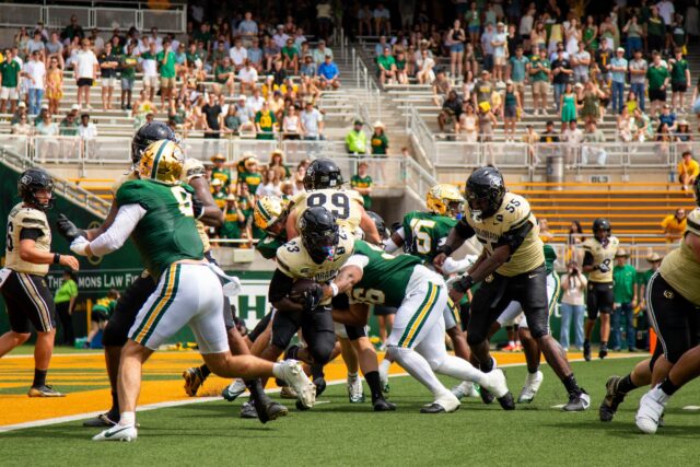 Senior defensive Line Kamren Washington tackles sophmore running back JaQuail Smith duing Baylor vs. Colorado at McLane Stadium on Saturday. Mim Robbins | Photographer.