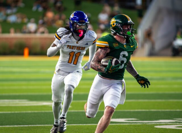 Fifth year wide receiver Gavin Freeman runs the ball down the field during Baylor's win against Prarie View A&M University 44-3 Saturday night at McLane Stadium. Mesha Mittanasala | Photographer