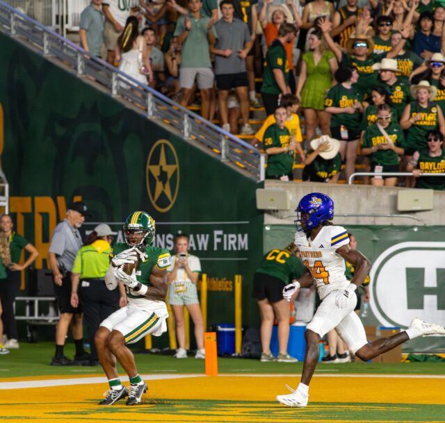 Fifth year wide receiver Jayden McGown catches to ball to score a touchdown during Baylor's win against Prarie View A&M University 44-3 Saturday night at McLane Stadium. Mesha Mittanasala | Photographer