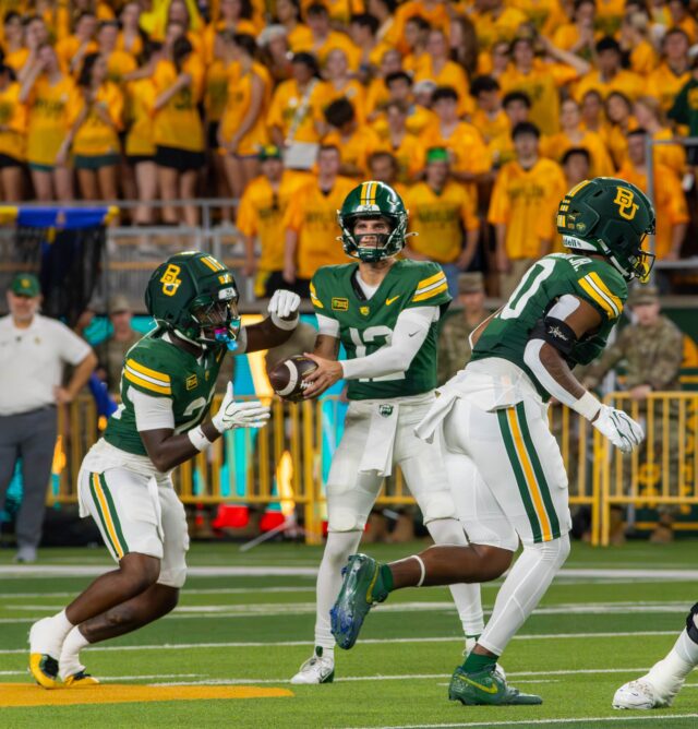Junior Quarterback Nate Bennett passes the ball to Fifth year