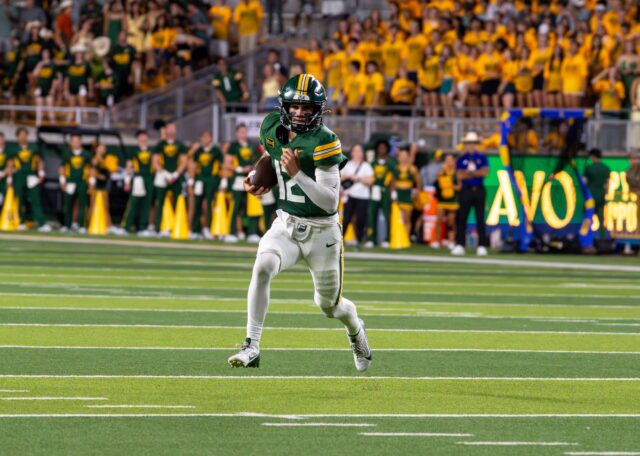 Junior Quarterback Nate Bennett passes the ball to Fifth year Reggie Bush II during Baylor's win against Prairie View A&M University 44-3 Saturday night at McLane Stadium. Mesha Mittanasala | Photographer
