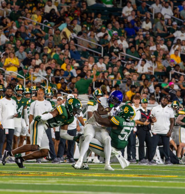 Sophmore Linebacker Kaleb Arterberry tackles Prairie View's widereceiver during Baylor's win against Prarie View A&M University 44-3 Saturday night at McLane Stadium. Mesha Mittanasala | Photographer