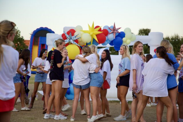 Students gather, embrace, and reunite with one another during Kappa Kappa Gamma&squot;s "Karnival" event near Fountain Mall on Wednesday afternoon. Walter Guerrero | Photographer