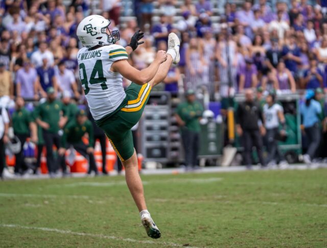 Senior punter Palmer Williams follows through a punt in Baylor's loss to TCU in 2025. Lariat file photo