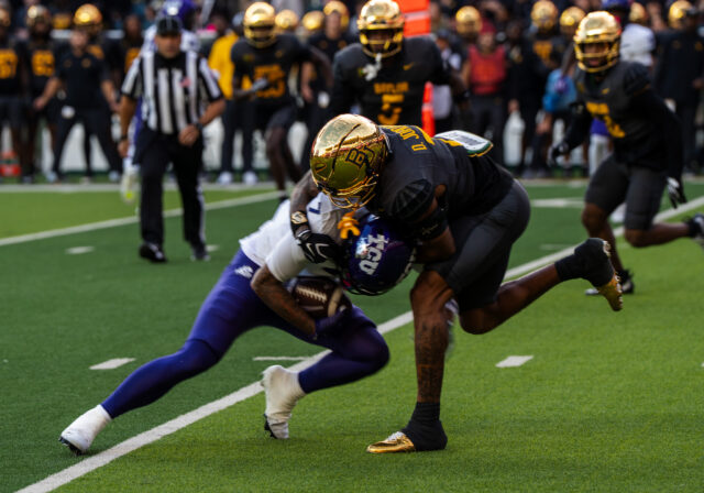 Junior cornerback Devon Jordan intercepts a pass at the TCU versus Baylor football game on Saturday evening. Caleb Garcia | Photo Editor