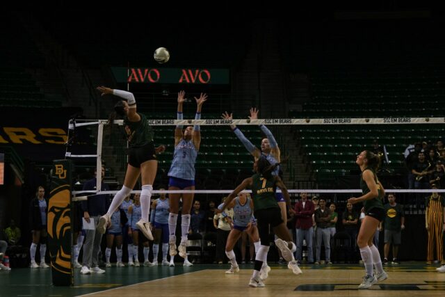 Sophomore outside hitter Ksenia Rakhmanchik prepares to go for the kill against the Jayhawks at the Ferrell Center on Sunday afternoon. Mady Mijares | Photographer