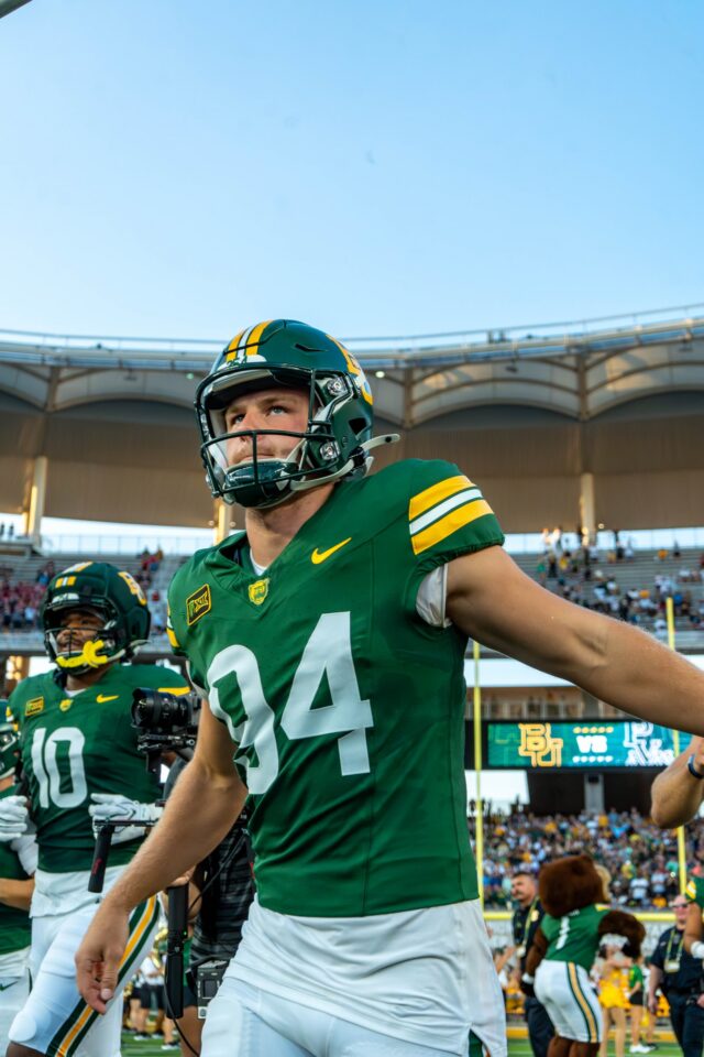 Senior punter Palmer Williams runs onto the field prior to Baylor's home opening win over Prairie View A&M. Mesha Mittanasala | Photographer
