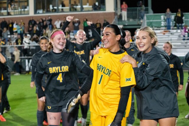 Baylor women’s soccer celebrates fifth year goalkeeper Azul Alvarez after Senior middle fielder Aryanna Jimison scores a goal during Baylor’s win against TCU 1-
0 at Betty Lou May’s field Friday night. Mesha Mittanasala | Photographer