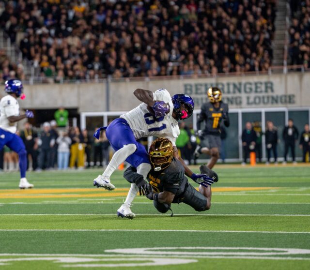 Fifth-year linebacker Travion Barnes tackles tight end Kari Ashley during Baylor's 17-6 loss against TCU at McLane Stadium Saturday night. Mesha Mittanasala | Photographer