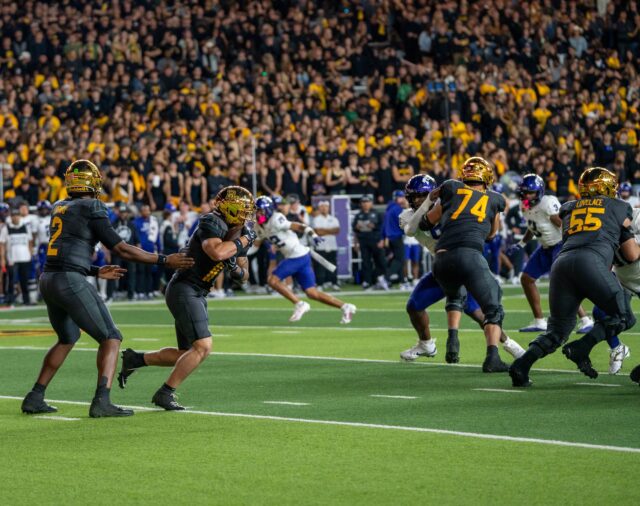 Junior quarterback DJ Lagway passes the ball to sophmore running back Caden Knighten during Baylor's loss against TCU 6-17 at Mclane Stadium saturday night. Mesha Mittanasala | Photographer