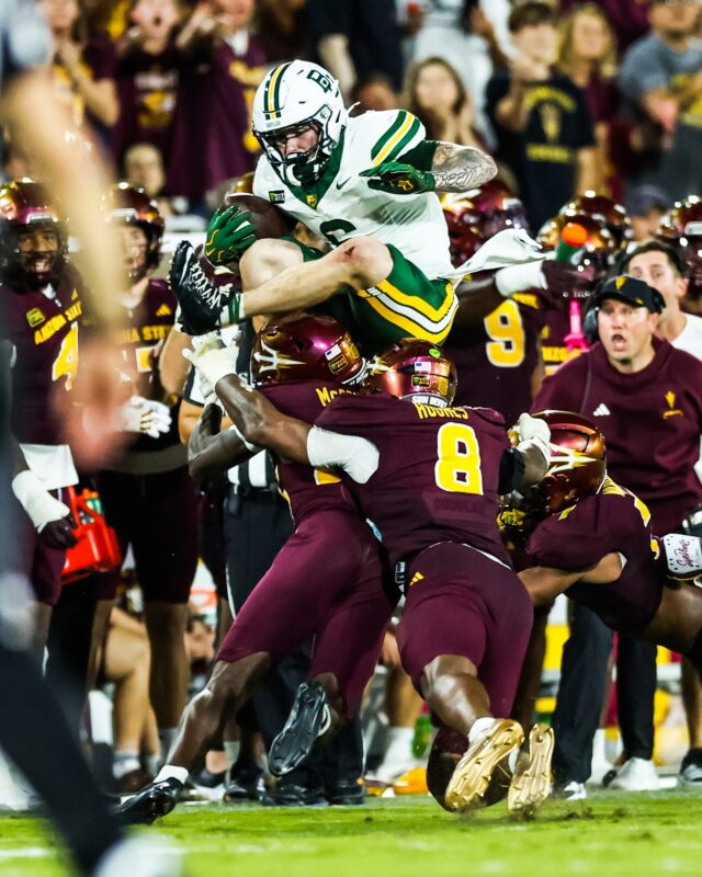 Fifth-year receiver Gravin Freeman hurdles a pair of Arizona State defenders for back-to-back weeks with a highlight reel leap. Photo courtesy of Baylor Athletics