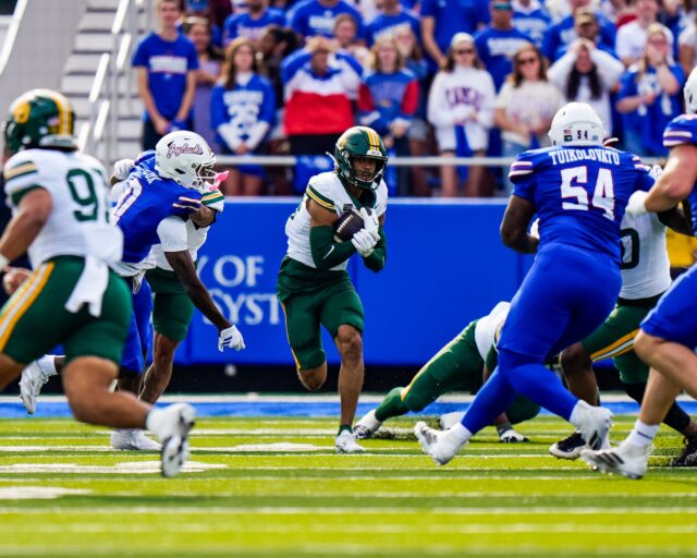 Senior safety Micah Gifford works him way through a sea of players after intercepting a pass from quarterback Isaiah Marshall. Photo courtesy of Baylor Athletics