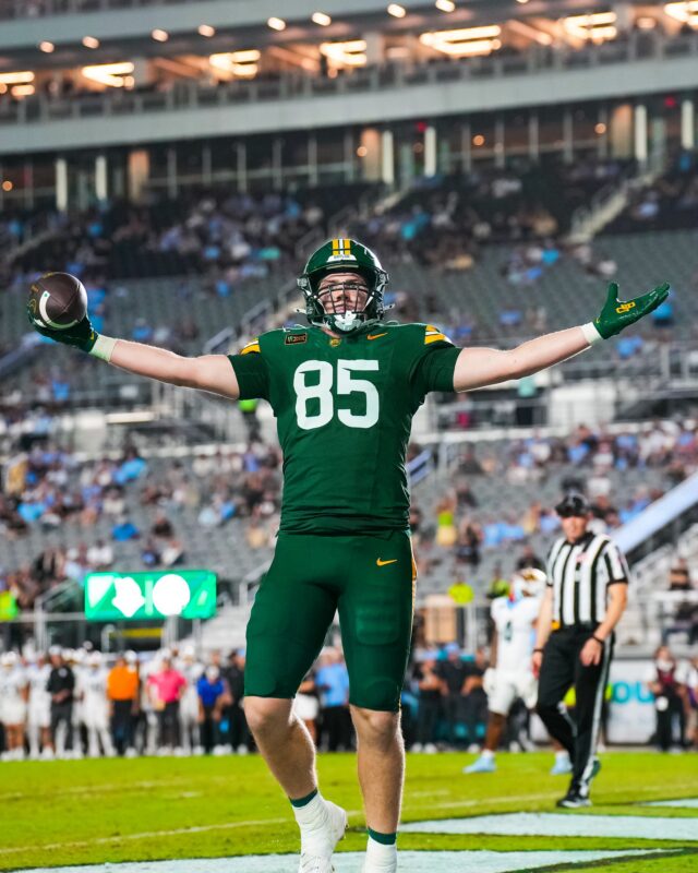 Senior tight end Matthew Klopfenstein lifts his arms to the crowd after scoring his first touchdown of the season. Photo courtesy of Baylor Athletics