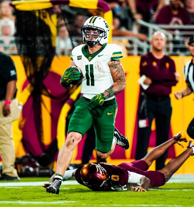 Sophomore running back Caden Knighten breaks a tackle from defensive back Rodney Bimage Jr. on his way to a 75-yard touchdown against Arizona State. Photo courtesy of Baylor Athletics