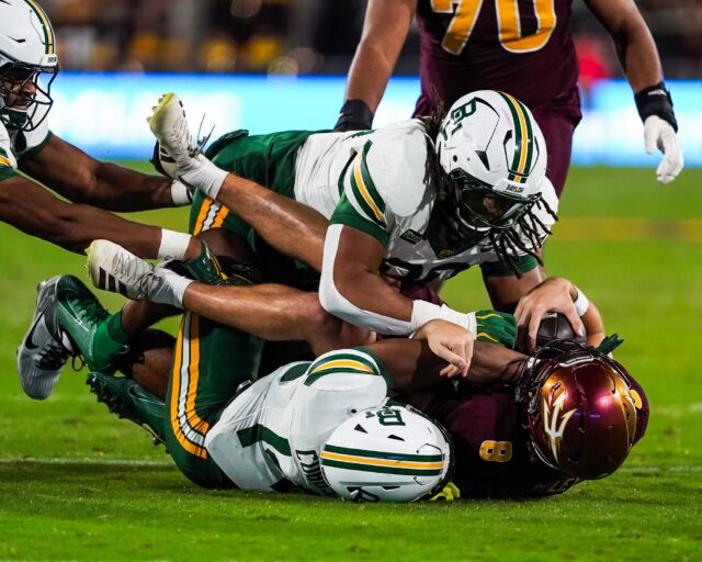 Senior safety Daniel Cobbs and fifth-year defensive lineman Braylen Jackson sack Arizona State quarterback Cutter Boley. Photo courtesy of Baylor Athletics